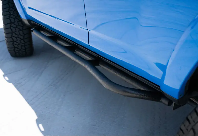 Cali Raised Bolt-On Rock Sliders For 2010–2024 Toyota 4Runner Trail Edition – Kick-Out Design With Bedliner Integration 1